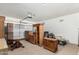 Spacious garage featuring ample storage with wooden furniture and an automatic door opener at 6372 S Callaway Dr, Chandler, AZ 85249