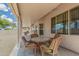 Inviting covered patio with outdoor dining set, perfect for relaxing and entertaining guests at 6372 S Callaway Dr, Chandler, AZ 85249