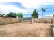 Backyard shed on a large lot with mature trees and a privacy fence at 742 E Garnet Ave, Mesa, AZ 85204