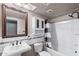 A renovated bathroom featuring subway tile, vanity sink, and bathtub with shower at 742 E Garnet Ave, Mesa, AZ 85204