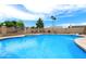 Refreshing backyard pool with trees, lush greenery, and seating at 742 E Garnet Ave, Mesa, AZ 85204