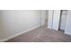 This bedroom features carpet, and closet space with white walls at 7531 E Billings St # 123, Mesa, AZ 85207