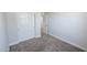 Bedroom featuring carpet, a closet with sliding doors, and white walls at 7531 E Billings St # 123, Mesa, AZ 85207