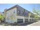 Modern two-story townhome featuring sleek gray and white exteriors with attached garages at 7531 E Billings St # 123, Mesa, AZ 85207