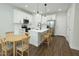 Bright kitchen features a center island, stainless steel appliances, and wood flooring at 7531 E Billings St # 123, Mesa, AZ 85207