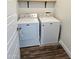 The laundry room includes a side-by-side washer and dryer and wood-look flooring at 7531 E Billings St # 123, Mesa, AZ 85207