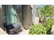 Outdoor patio with BBQ grill and landscaping features. Sliding glass door is visible at 7531 E Billings St # 123, Mesa, AZ 85207