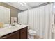 Bathroom with a single sink, white shower curtain, and neutral-toned walls at 763 E Park Ave, Chandler, AZ 85225