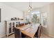 Bright dining room featuring a large wood table, comfortable seating, and plenty of natural light at 763 E Park Ave, Chandler, AZ 85225