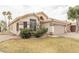 Inviting home exterior with a two-car garage, desert landscaping, and a tiled roof at 763 E Park Ave, Chandler, AZ 85225