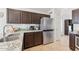 Kitchen features granite counters, stainless steel appliances, and ample storage space at 763 E Park Ave, Chandler, AZ 85225