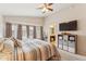 Spacious main bedroom features a comfortable bed, large windows, and an en-suite bathroom at 763 E Park Ave, Chandler, AZ 85225