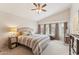 Serene main bedroom featuring a comfortable bed, large windows, and ample natural light at 763 E Park Ave, Chandler, AZ 85225