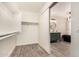 This bathroom boasts modern vanity and soaking tub and a walk in closet with ample space at 7869 W Market St, Glendale, AZ 85303