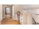 Bright hallway with a built-in desk and a view of the exterior through arched window at 7869 W Market St, Glendale, AZ 85303