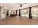 Bright living room featuring tiled floors, with views to the kitchen, backyard, and swimming pool at 7869 W Market St, Glendale, AZ 85303