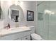 Charming bathroom featuring a modern vanity, stylish mirror, and a glass-enclosed shower with tile surround at 8140 N 107Th Ave # 142, Peoria, AZ 85345