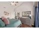 Bedroom features a sloped ceiling, ceiling fan, stylish decor, and a spacious layout at 8140 N 107Th Ave # 142, Peoria, AZ 85345