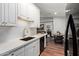 Modern kitchen featuring white cabinets, gold hardware, stainless steel appliances, and an undermount sink at 8140 N 107Th Ave # 142, Peoria, AZ 85345