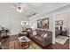 Bright living room with hardwood floors, with an adjacent bedroom view at 8140 N 107Th Ave # 142, Peoria, AZ 85345