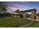 Expansive backyard featuring a trampoline, rock water feature, and covered outdoor kitchen, perfect for entertainment at 890 W Zion Pl, Chandler, AZ 85248