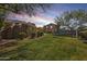 Spacious backyard featuring a rock structure and play structure, creating an engaging outdoor space at 890 W Zion Pl, Chandler, AZ 85248