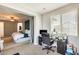 Bright room showing both bedroom and desk area with natural light and ceiling fan at 890 W Zion Pl, Chandler, AZ 85248