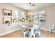 Bright dining room features a round table with seating for six, modern decor, and natural light at 890 W Zion Pl, Chandler, AZ 85248