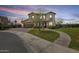 Beautiful two-story home featuring a well-manicured lawn, desert landscaping, and an attached garage at 890 W Zion Pl, Chandler, AZ 85248
