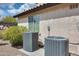Exterior shot of air conditioning units with a home's neutral stucco and tile roof at 890 W Zion Pl, Chandler, AZ 85248