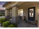 Charming front porch with stone pillars, a cozy bench, and decorative plants and landscaping at 890 W Zion Pl, Chandler, AZ 85248