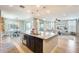 Open floor plan featuring a kitchen with a large island and seating that flows into the dining and living areas at 890 W Zion Pl, Chandler, AZ 85248