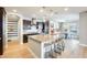 Spacious kitchen features a large island with granite countertops, dark cabinets, and an adjacent dining area at 890 W Zion Pl, Chandler, AZ 85248