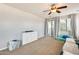 Bright living room with plush seating, natural light, and access to a balcony with scenic views at 890 W Zion Pl, Chandler, AZ 85248