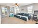 Bright living room with plush seating, natural light, and access to a balcony with scenic views at 890 W Zion Pl, Chandler, AZ 85248