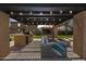 Inviting outdoor living space with built-in grill, TV, fire pit, and comfortable seating under a pergola at 890 W Zion Pl, Chandler, AZ 85248
