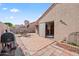 A delightful backyard with an outdoor grill, a patio set, and a sliding glass door into the home at 945 N Pasadena -- # 35, Mesa, AZ 85201