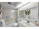 Well-lit bathroom with a vanity, shower, and skylight at 945 N Pasadena -- # 35, Mesa, AZ 85201