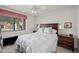 Inviting bedroom featuring a comfortable bed, plush carpet, and abundant natural light at 945 N Pasadena -- # 35, Mesa, AZ 85201