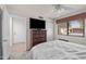 Comfortable bedroom featuring a bed, chest of drawers, and ample closet space at 945 N Pasadena -- # 35, Mesa, AZ 85201