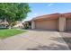 Single-story home featuring a two-car garage and low-maintenance front yard landscaping at 945 N Pasadena -- # 35, Mesa, AZ 85201