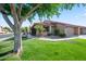 Charming single-story home featuring a well-maintained lawn and desert landscaping at 945 N Pasadena -- # 35, Mesa, AZ 85201