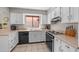 Well-lit kitchen with white cabinets, modern appliances, and tile flooring at 945 N Pasadena -- # 35, Mesa, AZ 85201