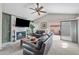 Comfortable living room featuring a fireplace, ceiling fan, and sliding doors to the patio at 945 N Pasadena -- # 35, Mesa, AZ 85201