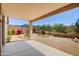 Backyard featuring desert landscaping and a covered patio with mountain views at 10351 E Morning Star Dr, Scottsdale, AZ 85255