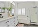 Elegant bathroom with dual vanity, tub, shower, modern fixtures, and lots of natural light at 10351 E Morning Star Dr, Scottsdale, AZ 85255