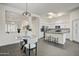 Modern kitchen with stainless steel appliances, an island, and an adjoining dining area at 10351 E Morning Star Dr, Scottsdale, AZ 85255
