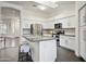 Bright kitchen with white cabinets, stainless appliances, and hardwood floors at 10351 E Morning Star Dr, Scottsdale, AZ 85255