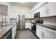 Modern kitchen featuring stainless steel appliances, white cabinets, and modern countertops at 10351 E Morning Star Dr, Scottsdale, AZ 85255