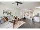 Open concept living and dining area with modern decor, neutral color palette, and hardwood floors at 10351 E Morning Star Dr, Scottsdale, AZ 85255